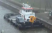 Multicat multipurpose vessel with hydraulic crane & spud pole legs